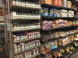 A large variety of spices in their spice rack.